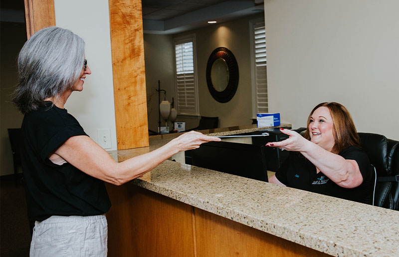 Photo of new patient visiting Dr. Welch's Brassfield New Garden dental office