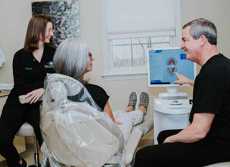 Photo of dentist adding white fillings